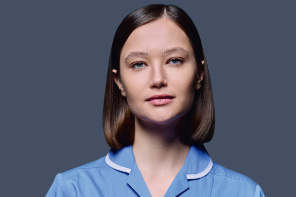 Image of a female nurse looking to camera