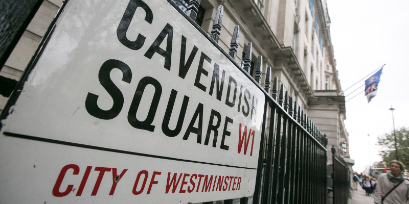 Street sign for Cavendish Square, with RCN HQ in background.