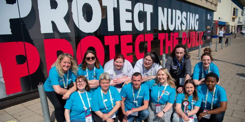 RCN UK Students Committee 2023 all wearing blue T-shirts outside the Brighton Centre for RCN Congress 2023