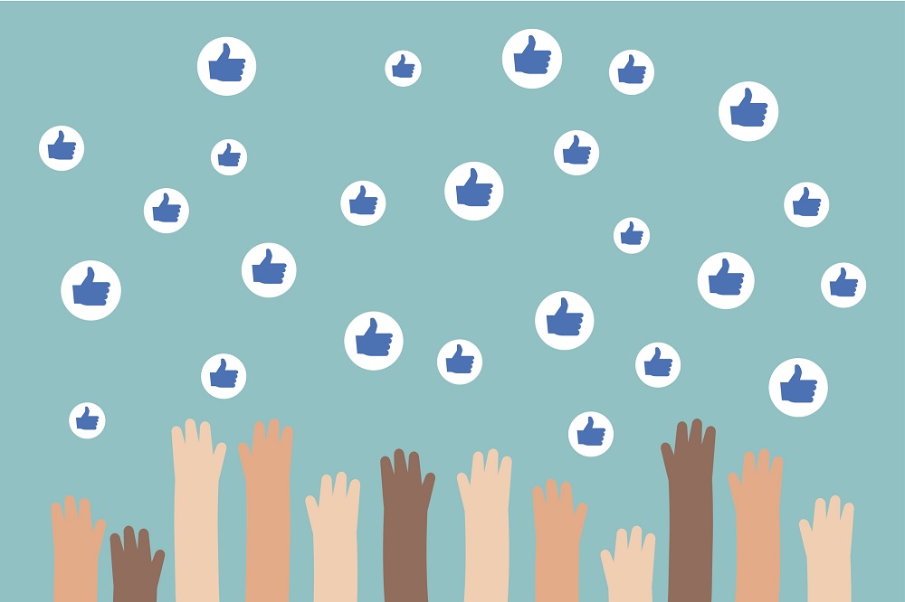 Graphic of hands reaching up to touch Facebook likes.