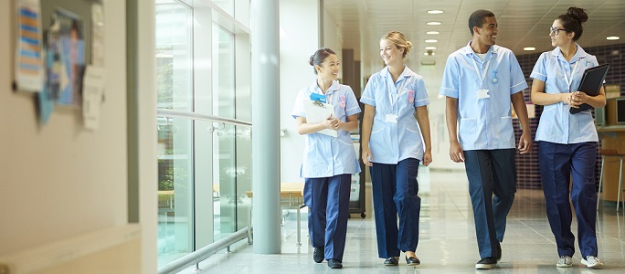 Student nurses walking down a corridor