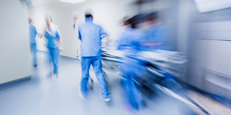 Blurred photo of a busy hospital corridor